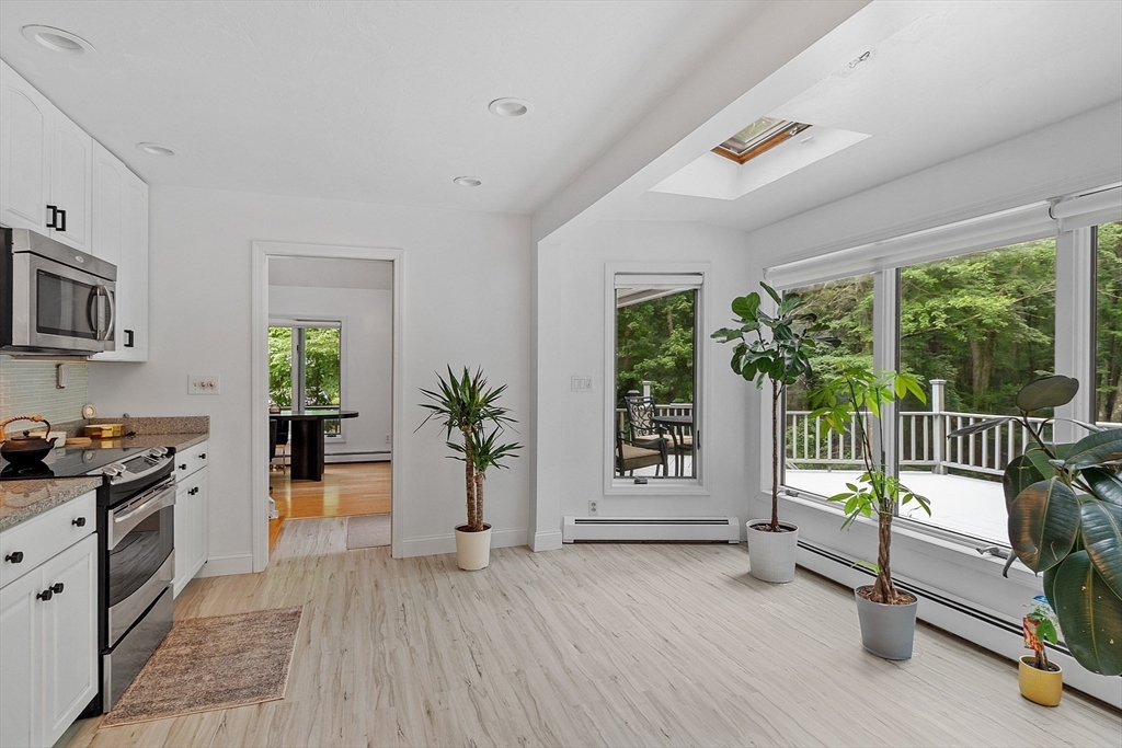 18 Crane Crossing Road Plaistow, NH 03865 - Photo 18 of 36 a view of livingroom with furniture and floor to ceiling window