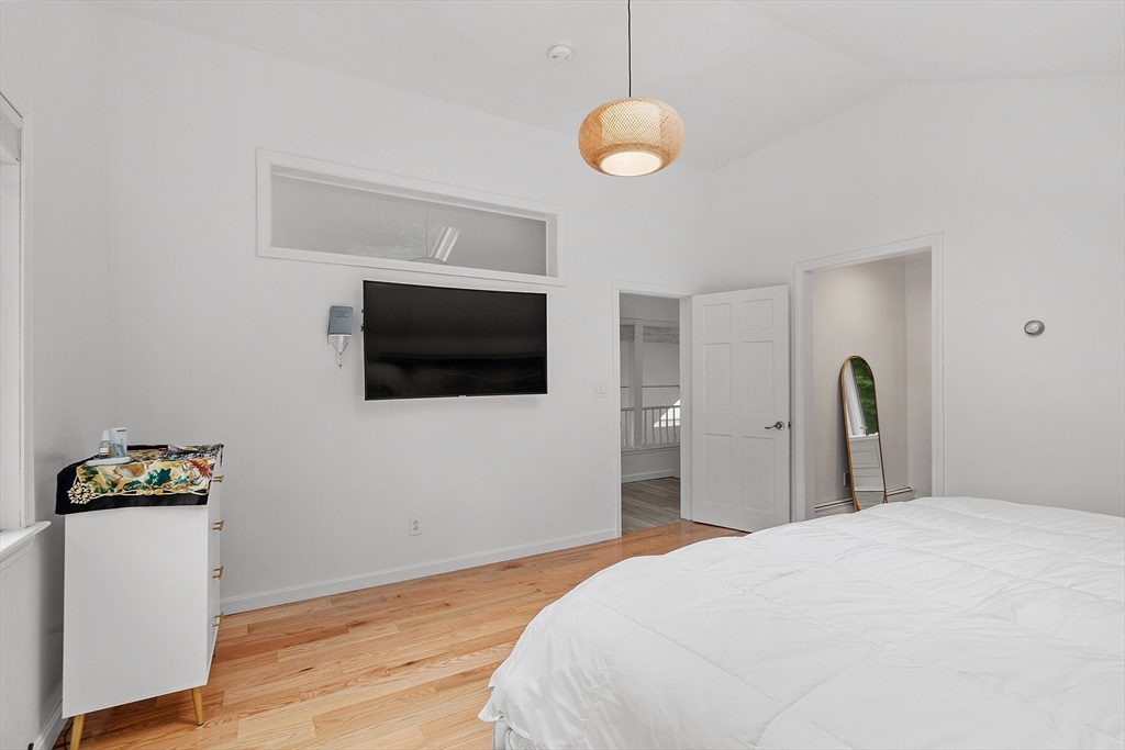 18 Crane Crossing Road Plaistow, NH 03865 - Photo 26 of 36 a bedroom with a bed and wooden floor