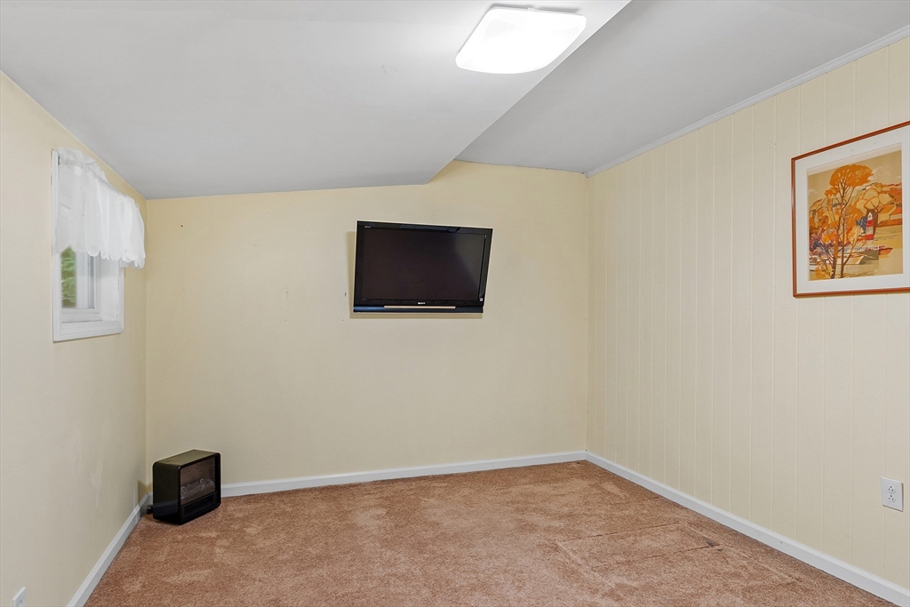 18 Crane Crossing Road Plaistow, NH 03865 - Photo 35 of 36 a view of an empty room with wooden floor and a window