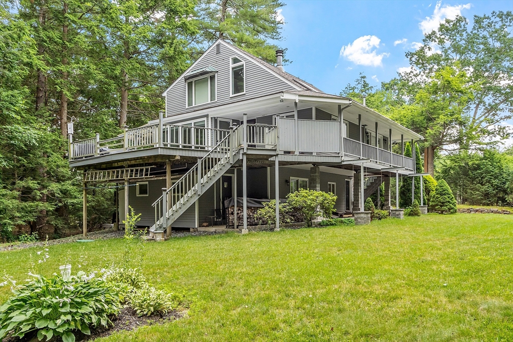 18 Crane Crossing Road Plaistow, NH 03865 - Photo 5 of 36 a view of a house with a yard balcony and sitting area