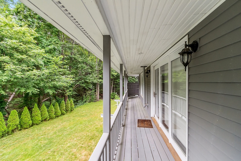 18 Crane Crossing Road Plaistow, NH 03865 - Photo 10 of 36 a view of balcony with wooden floor and fence