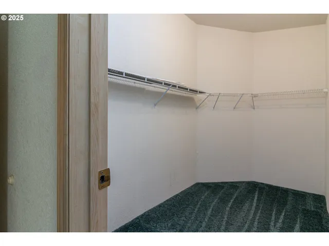 a view of an empty walk in closet