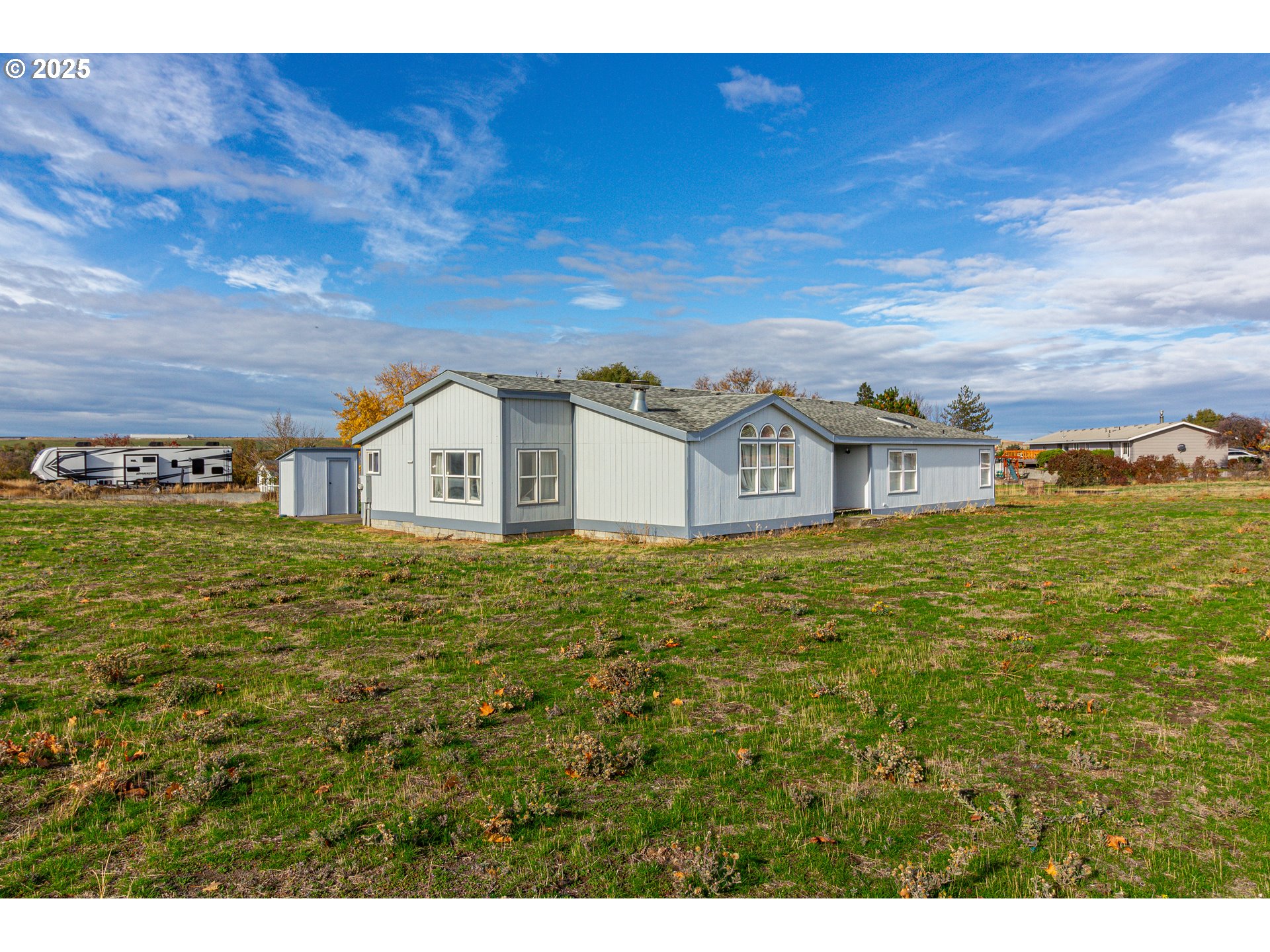 30683 Spring Court Hermiston, OR 97838 - Photo 2 of 29 a house view with a outdoor space