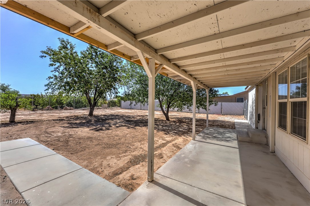 348 Tres Palomas Street Overton, NV 89040 - Photo 35 of 41 A spacious covered patio overlooks a large, undeveloped backyard offering privacy and potential.
