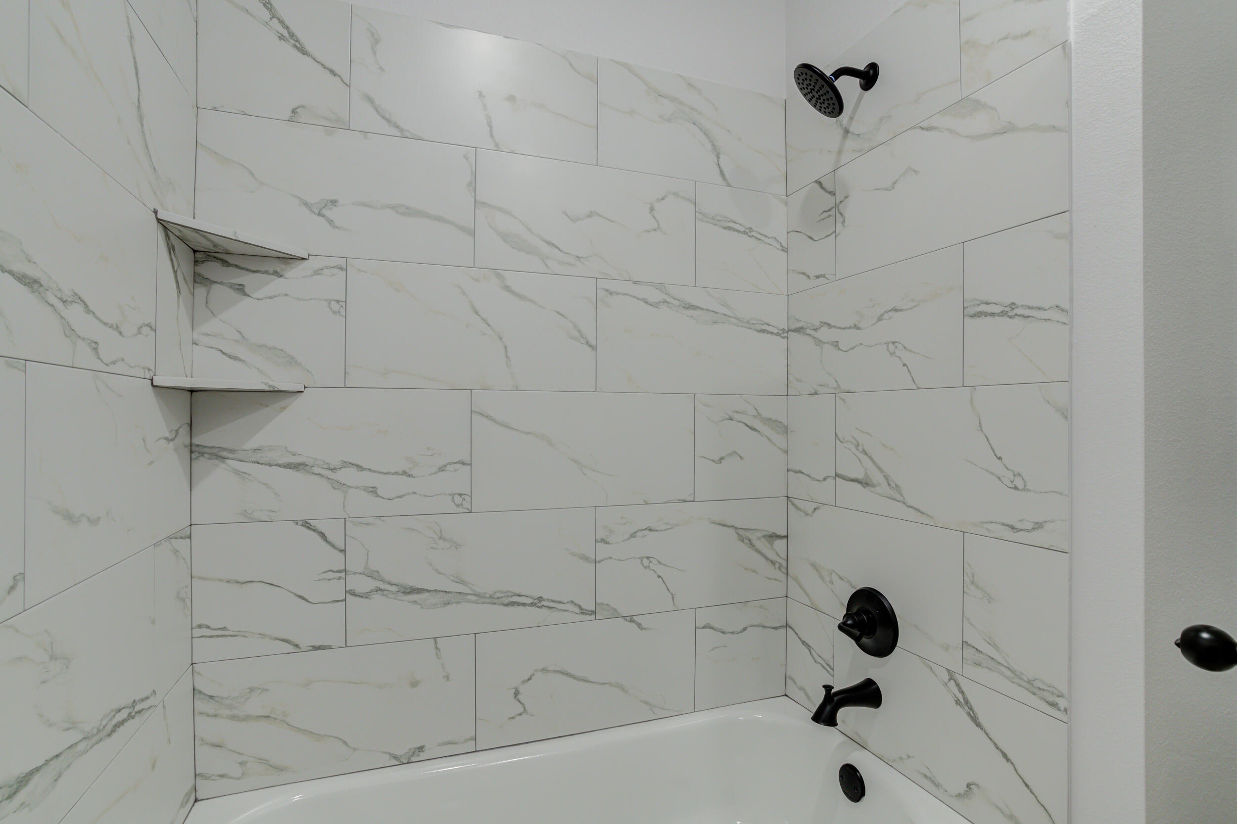 5808 Viola Avenue Lubbock, TX 79407 - Photo 14 of 60 a bathroom with a bathtub