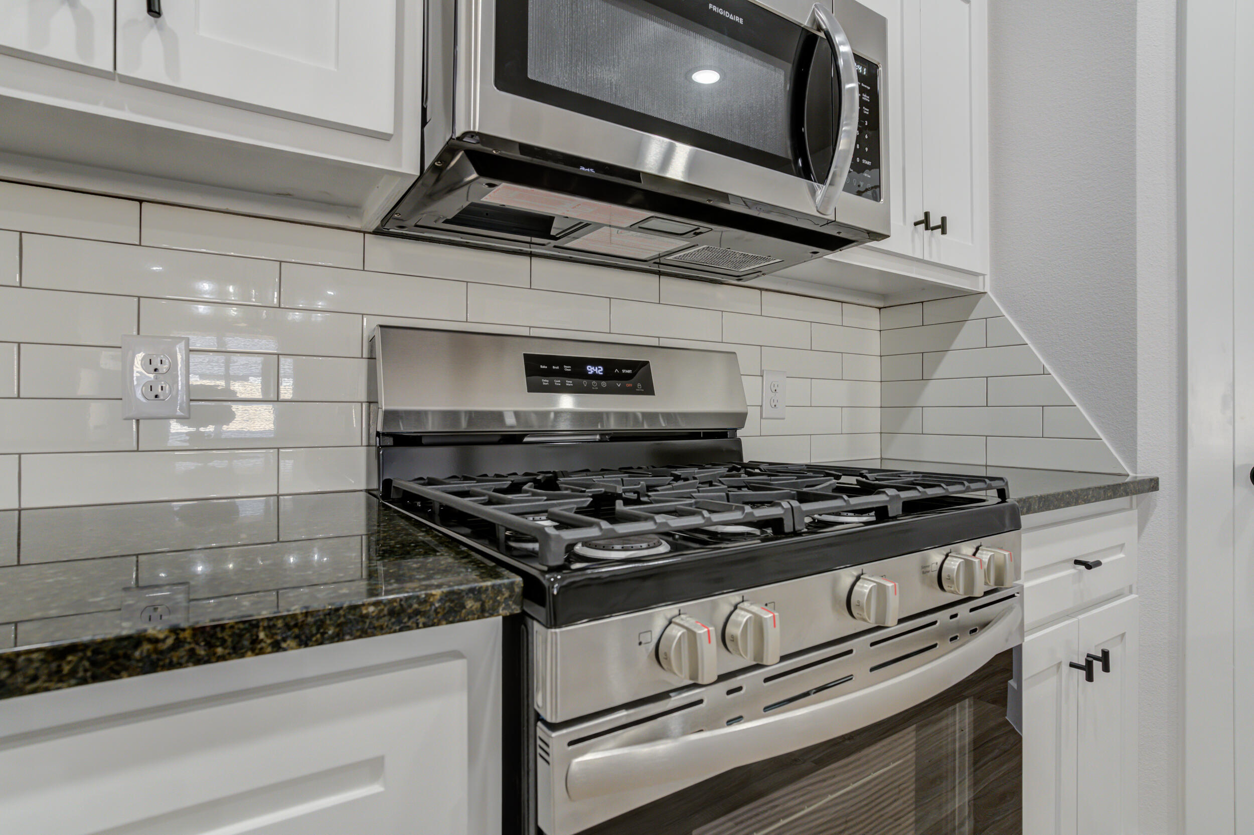 5808 Viola Avenue Lubbock, TX 79407 - Photo 19 of 60 a stove top oven sitting inside of a kitchen
