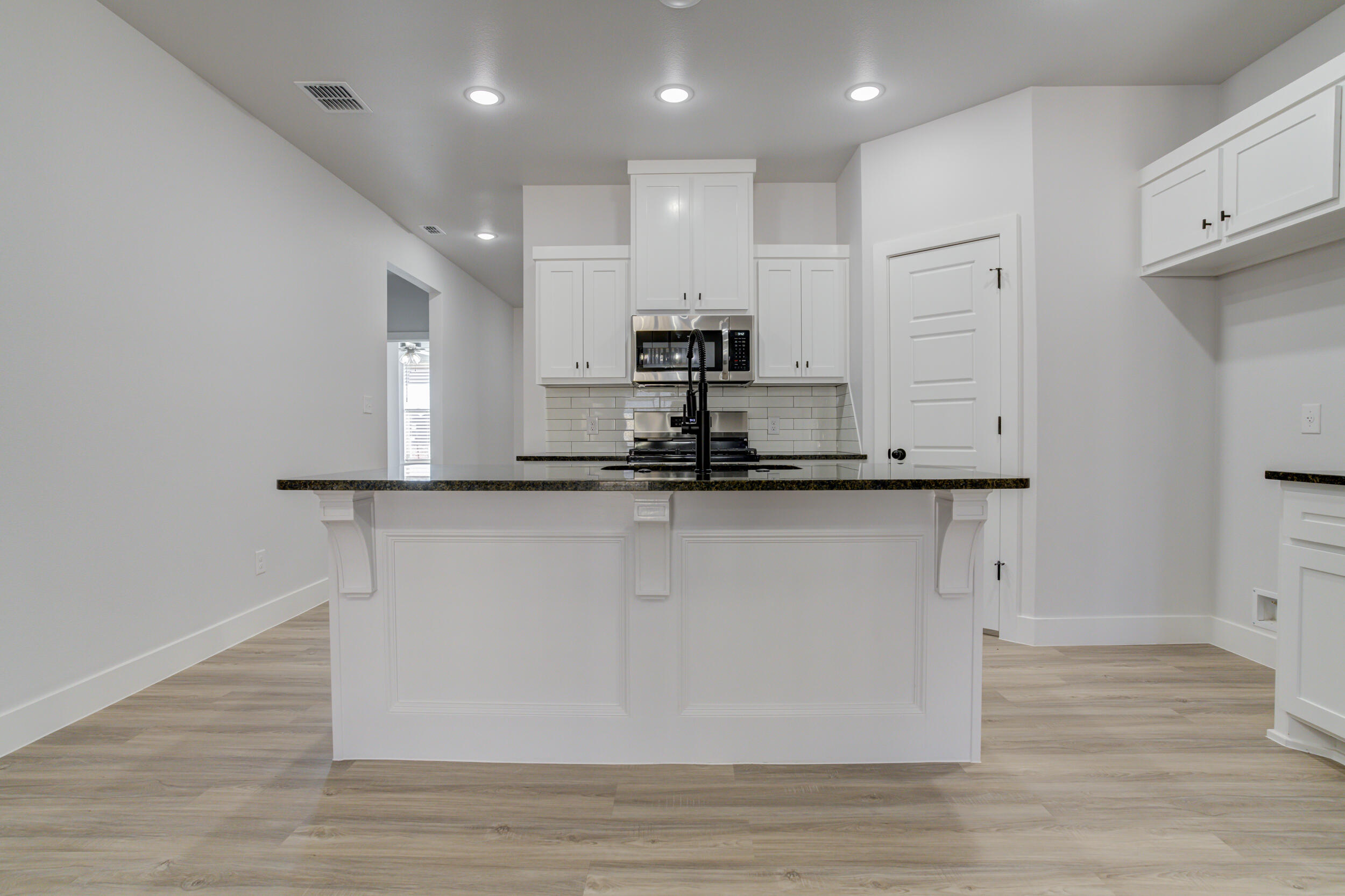 5808 Viola Avenue Lubbock, TX 79407 - Photo 24 of 60 a view of kitchen with stainless steel appliances granite countertop refrigerator sink and stove