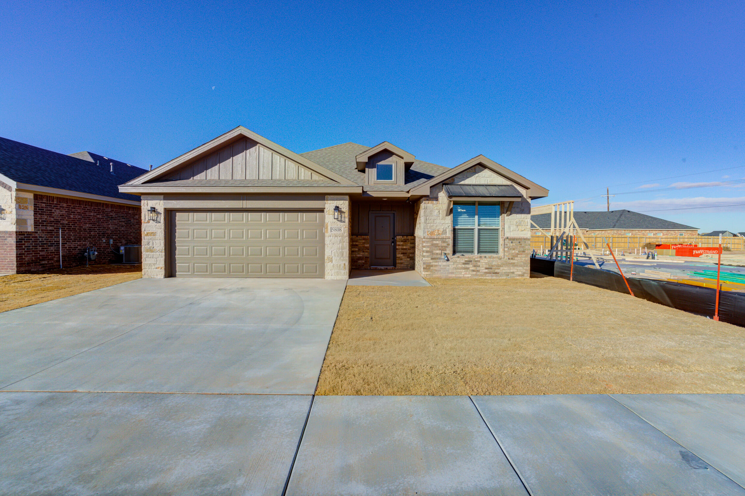 5808 Viola Avenue Lubbock, TX 79407 - Photo 3 of 60 a front view of a house with a yard