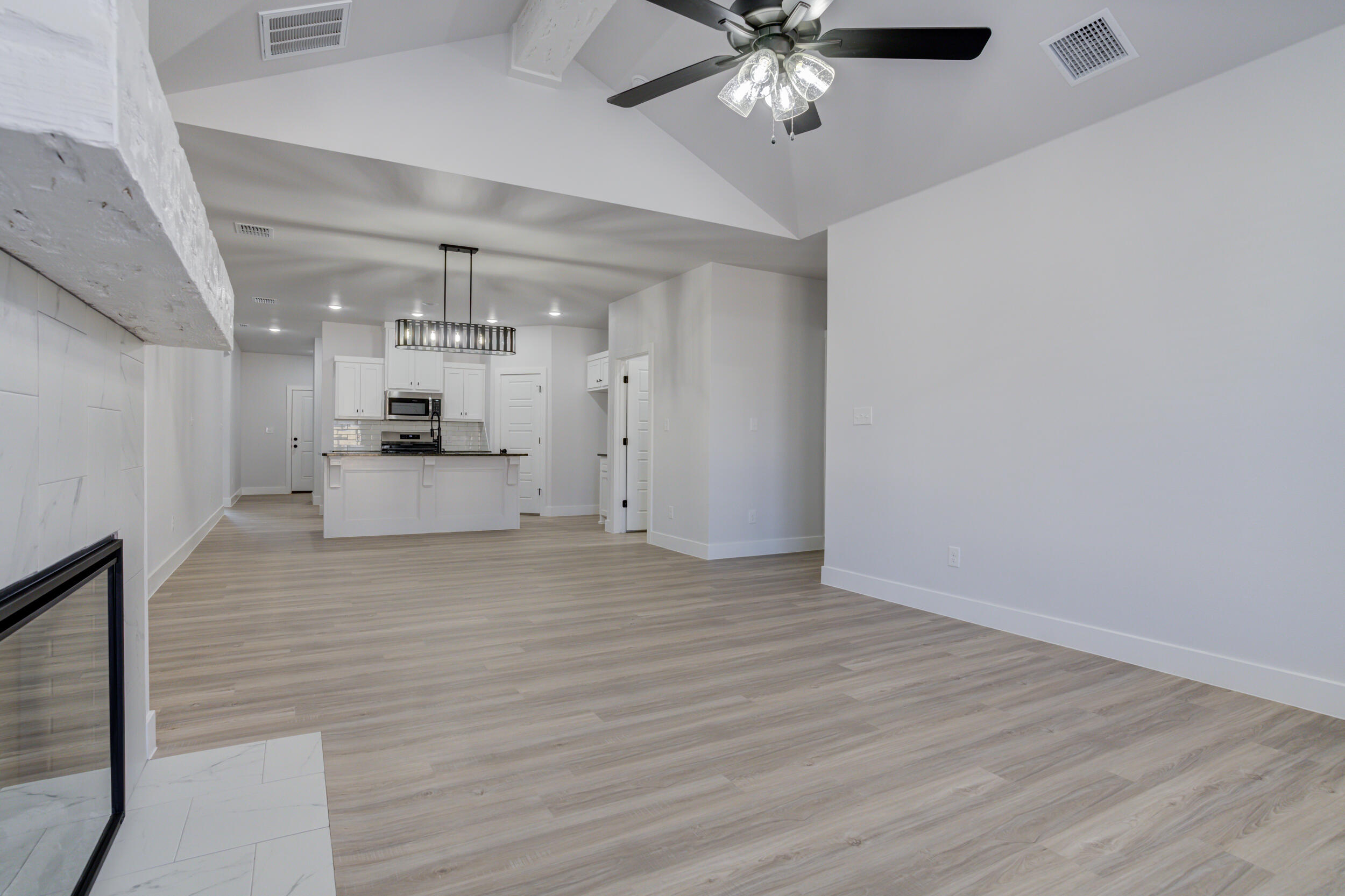 5808 Viola Avenue Lubbock, TX 79407 - Photo 34 of 60 a view of a kitchen with a sink and a stove