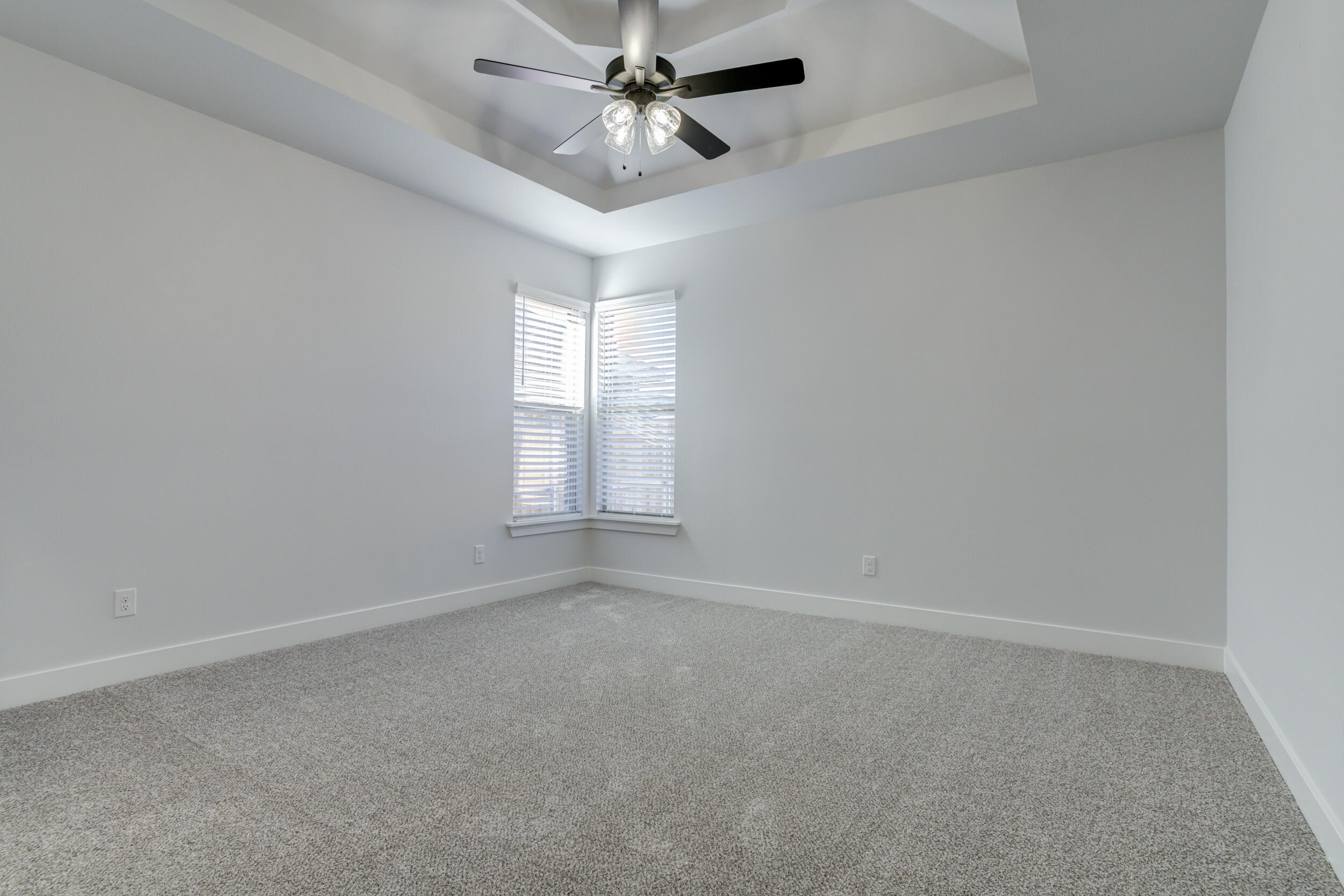 5808 Viola Avenue Lubbock, TX 79407 - Photo 37 of 60 an empty room with windows and fan