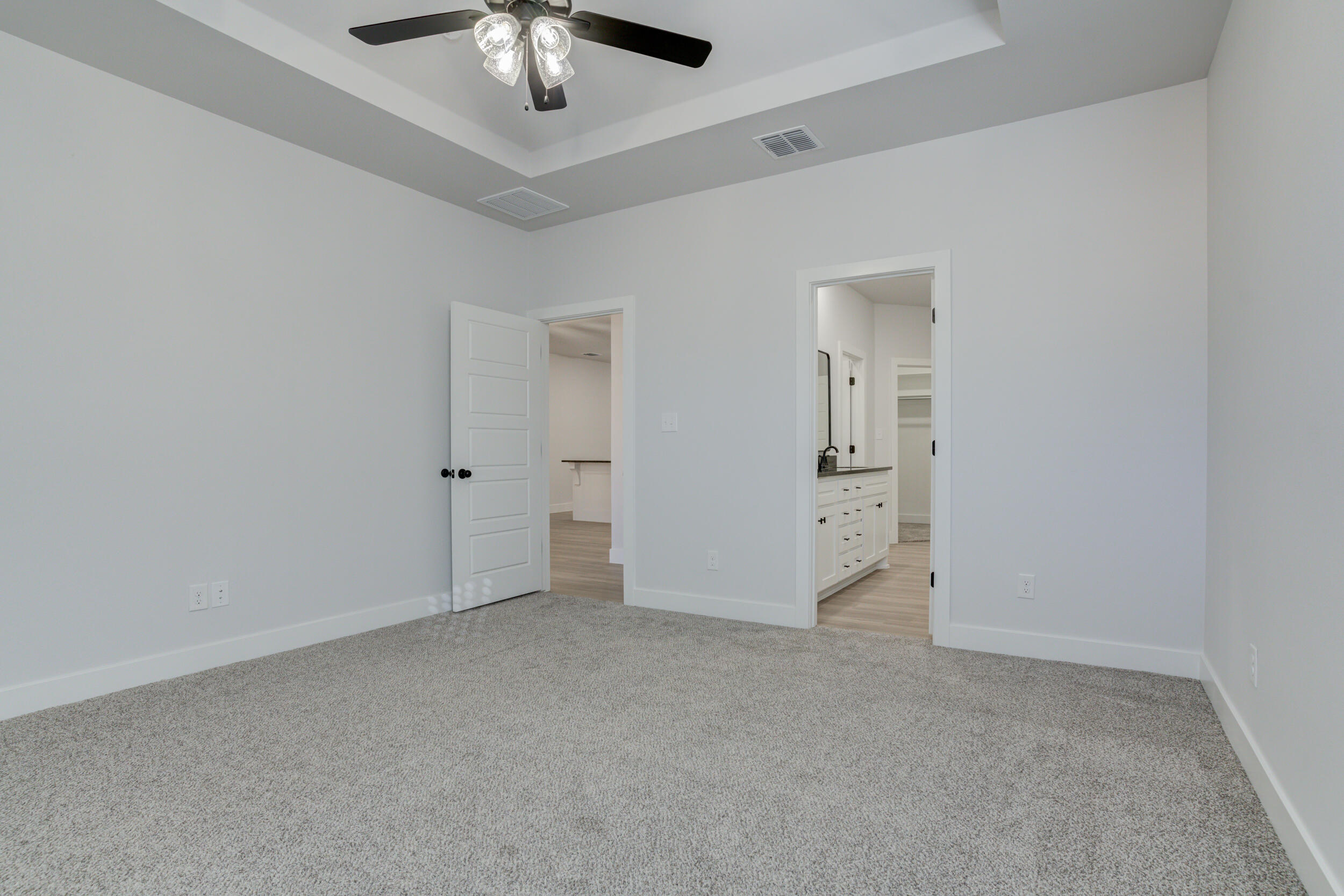 5808 Viola Avenue Lubbock, TX 79407 - Photo 39 of 60 an empty room with chandelier fan and windows