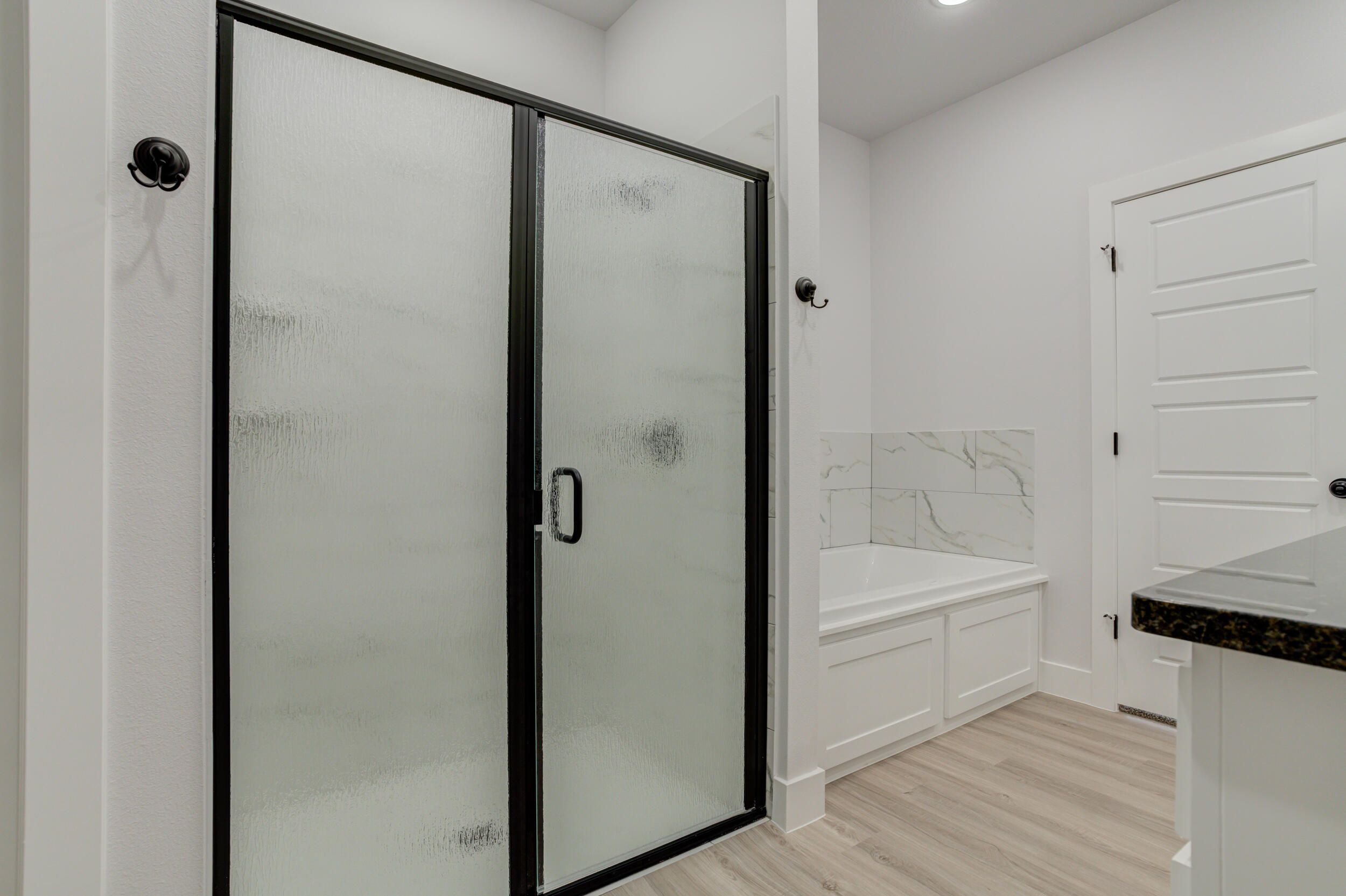 5808 Viola Avenue Lubbock, TX 79407 - Photo 44 of 60 a bathroom with a bathtub and a shower