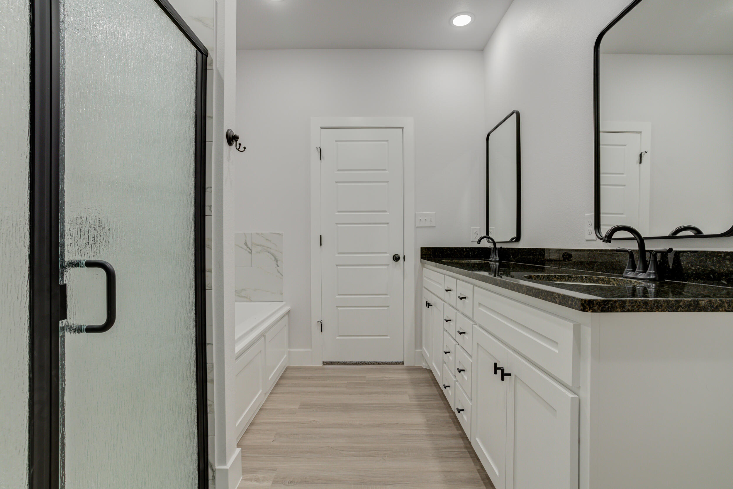 5808 Viola Avenue Lubbock, TX 79407 - Photo 45 of 60 a bathroom with double vanity and mirrors
