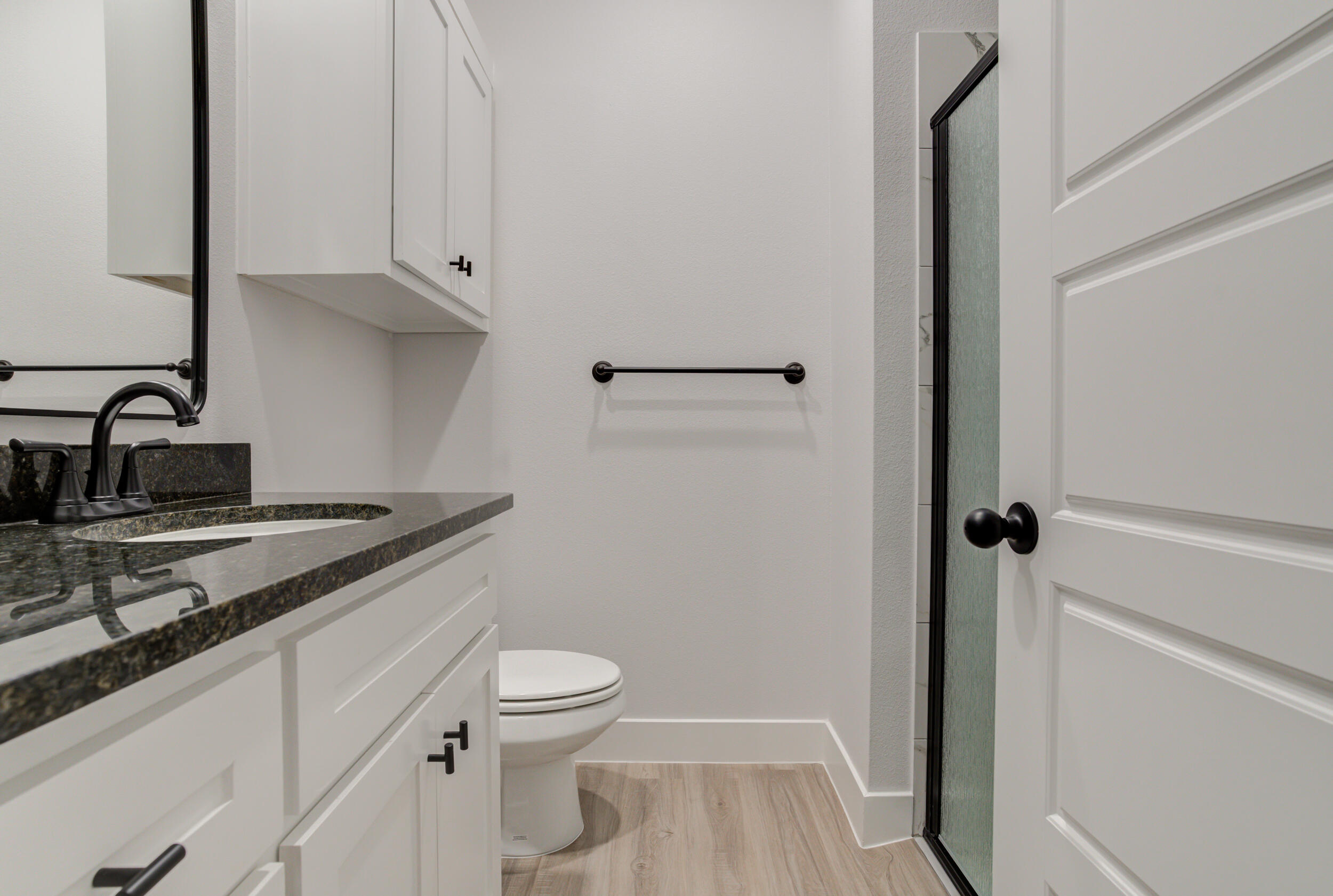5808 Viola Avenue Lubbock, TX 79407 - Photo 55 of 60 a bathroom with a granite countertop sink toilet and shower