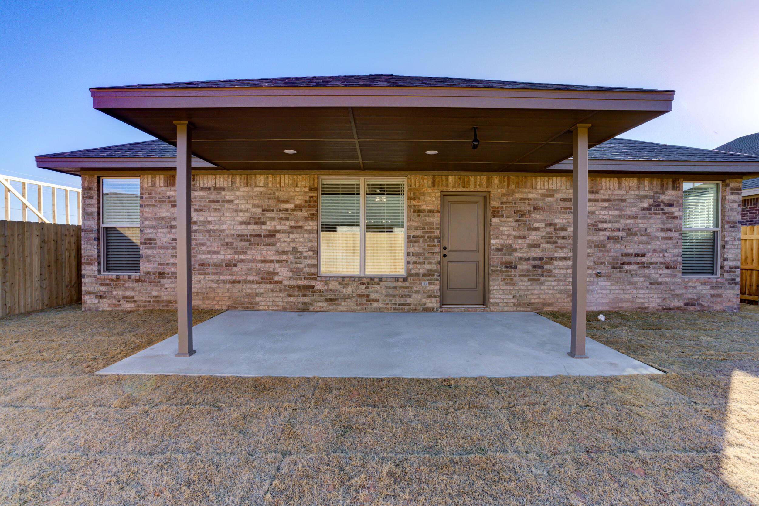 5808 Viola Avenue Lubbock, TX 79407 - Photo 58 of 60 a front view of a house with a porch