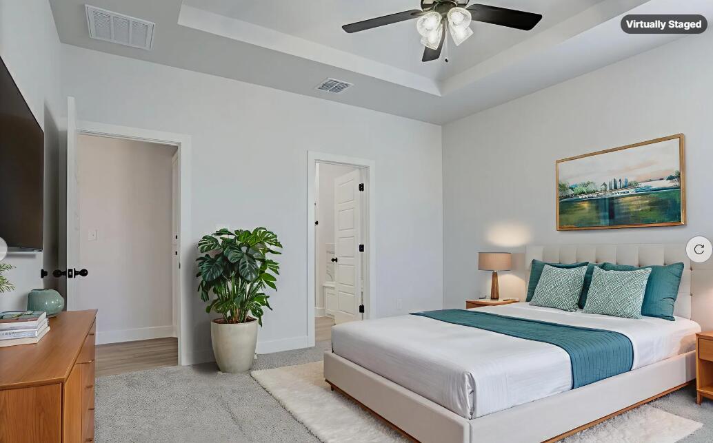 5808 Viola Avenue Lubbock, TX 79407 - Photo 6 of 60 a bedroom with a large bed and a potted plant