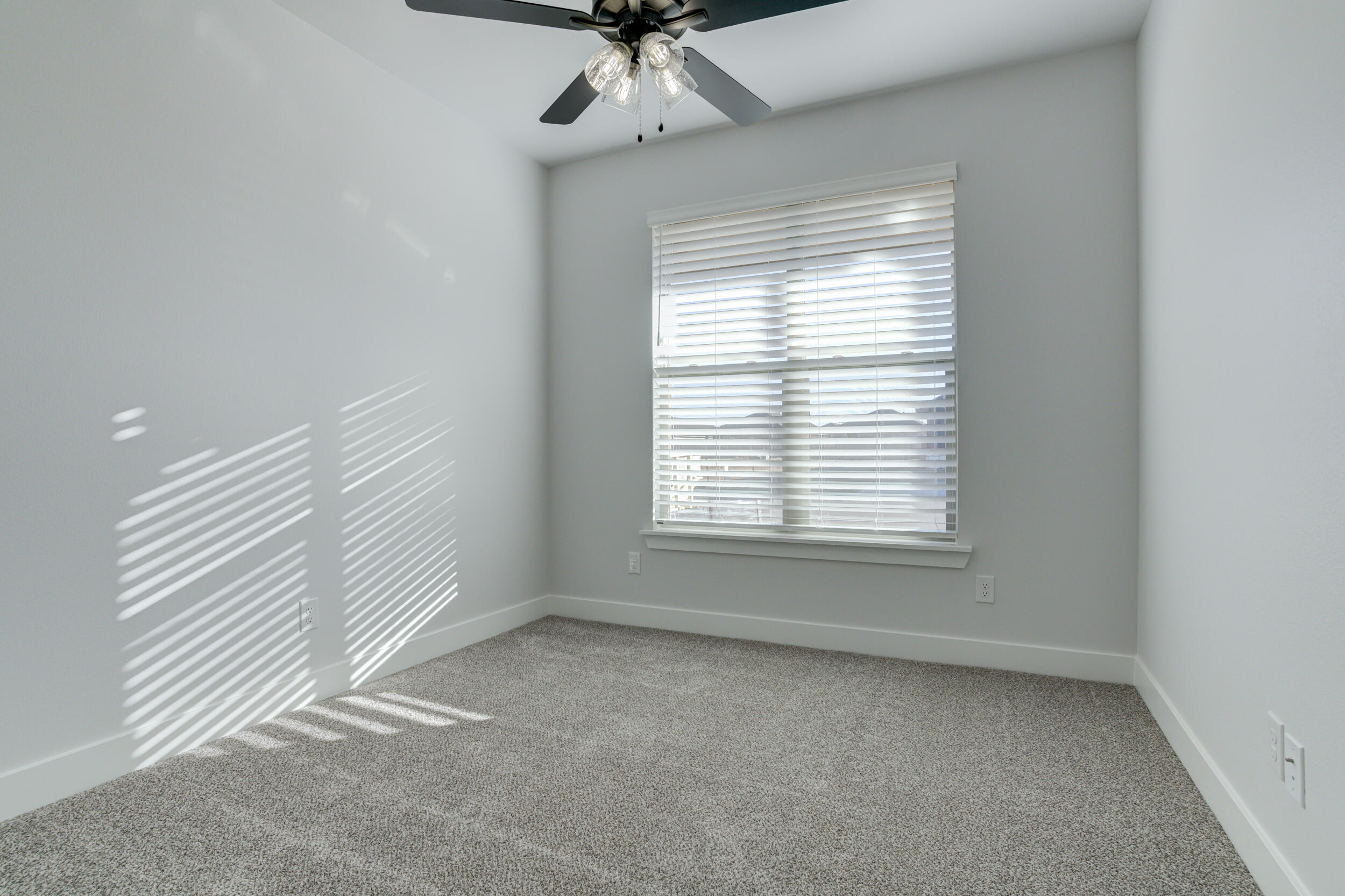 5808 Viola Avenue Lubbock, TX 79407 - Photo 10 of 60 a view of an empty room with a window