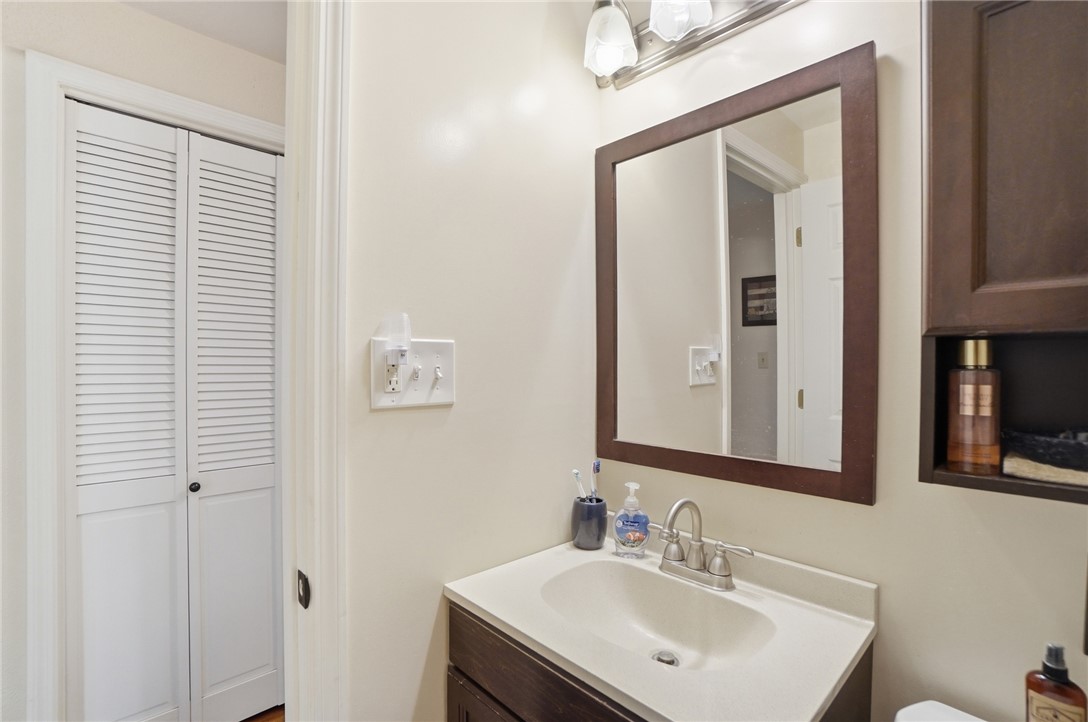 4170 Johnson Road Springfield, OH 45502 - Photo 50 of 54 Functional vanity and mirror create a welcoming bathroom space.
