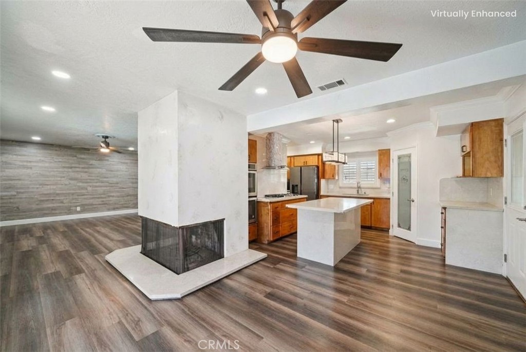 901 North Acacia Avenue, Unit 1 Rialto, CA 92376 - Photo 1 of 1 a large kitchen with kitchen island a sink stainless steel appliances and cabinets