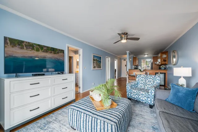 a living room with furniture and a flat screen tv