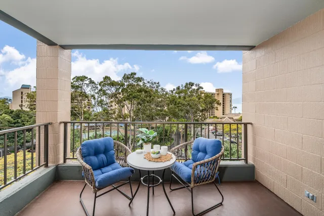 a view of a patio with table and chairs and potted plants