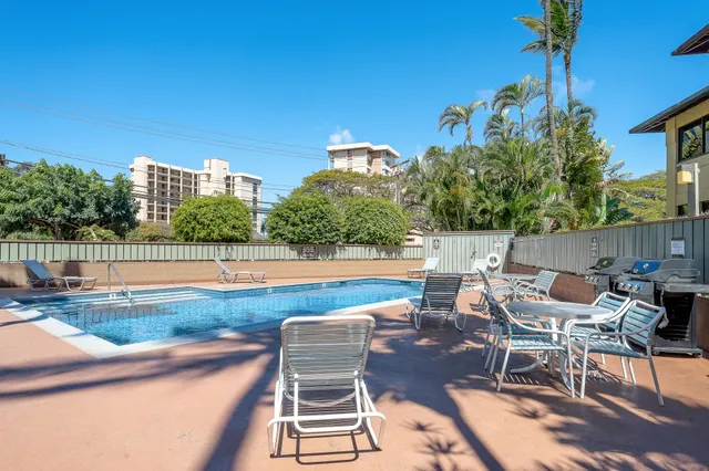 a view of a swimming pool with a lounge chairs