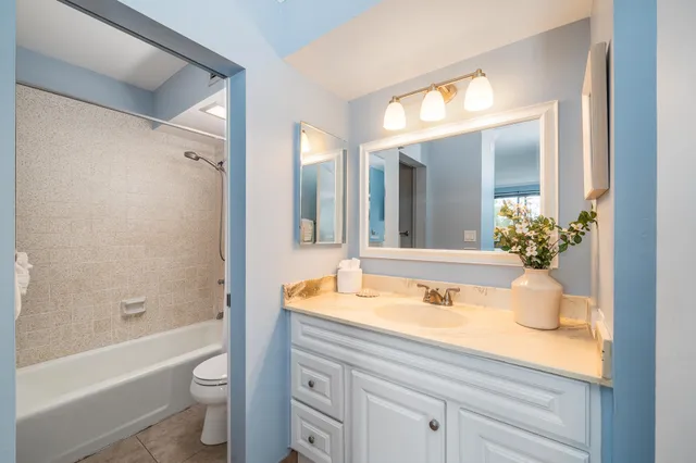 a view of a chair and table on the deck
