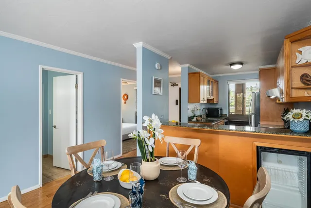a kitchen with a table and chairs in it