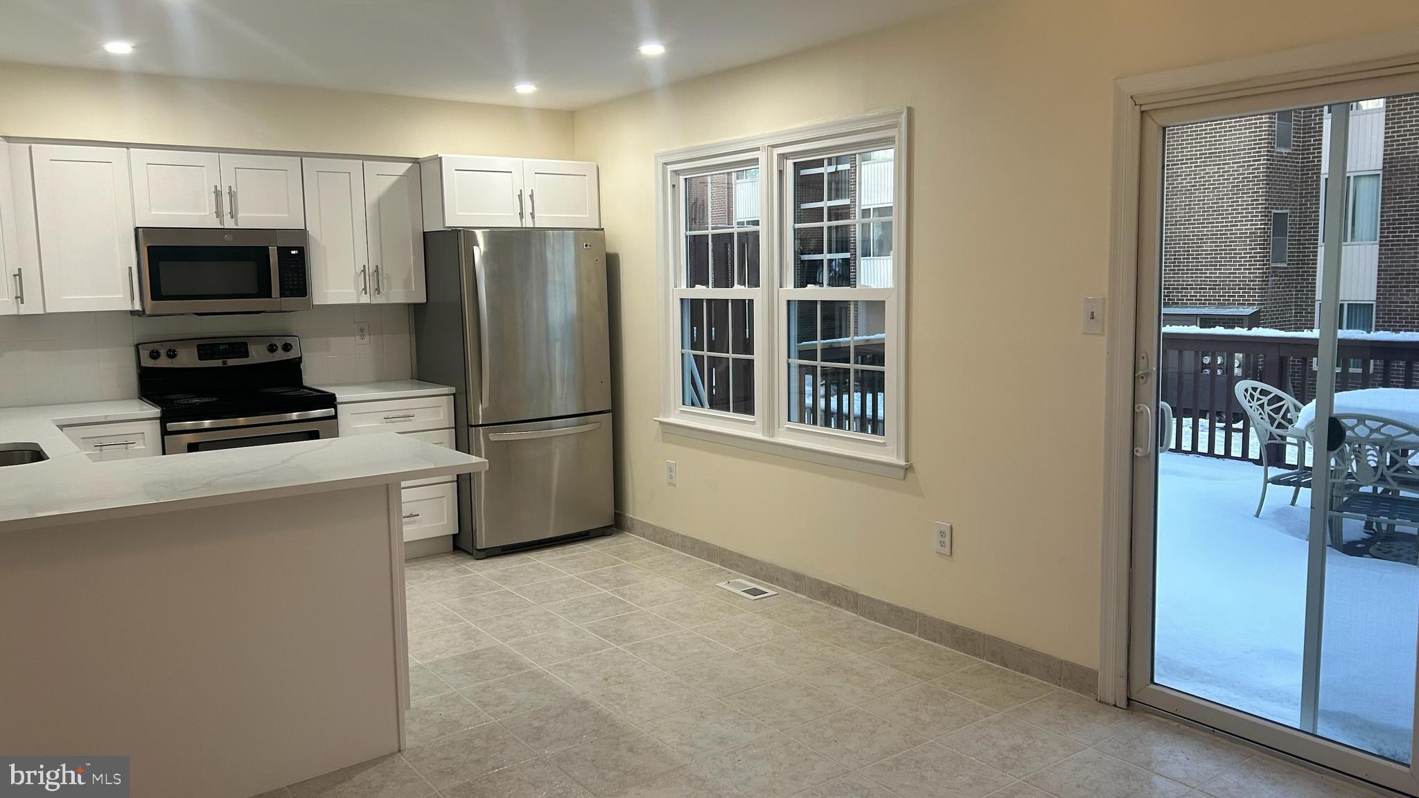3339 Beaverwood Lane Silver Spring, MD 20906 - Photo 1 of 30 a kitchen with stainless steel appliances a refrigerator and a stove top oven