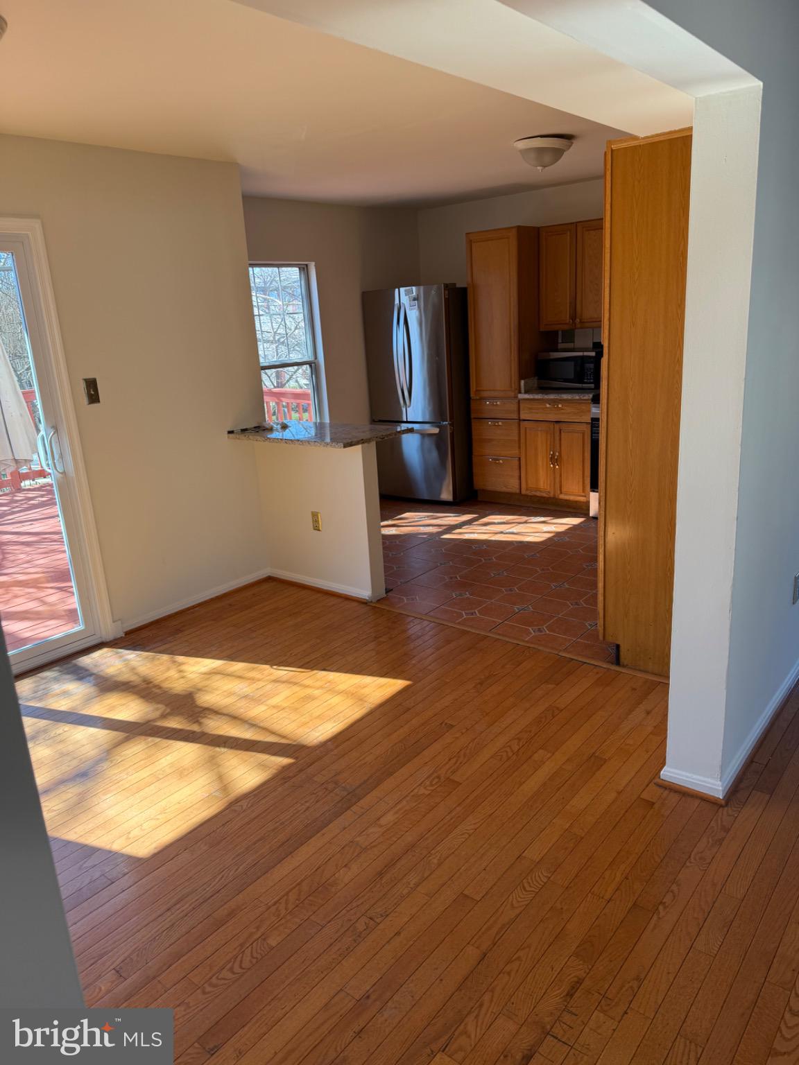 12150 Turnstone Court, Unit 90 Silver Spring, MD 20904 - Photo 4 of 19 wooden floor in an empty room