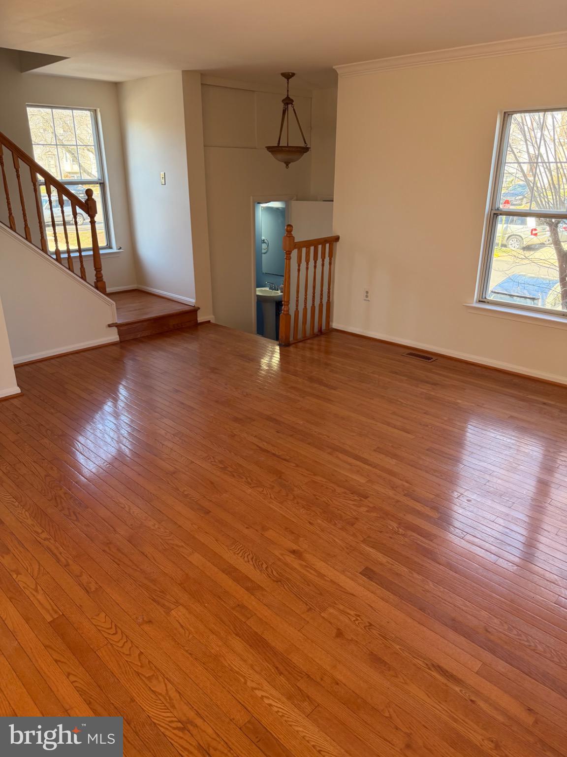 12150 Turnstone Court, Unit 90 Silver Spring, MD 20904 - Photo 5 of 19 wooden floor in an empty room with a window