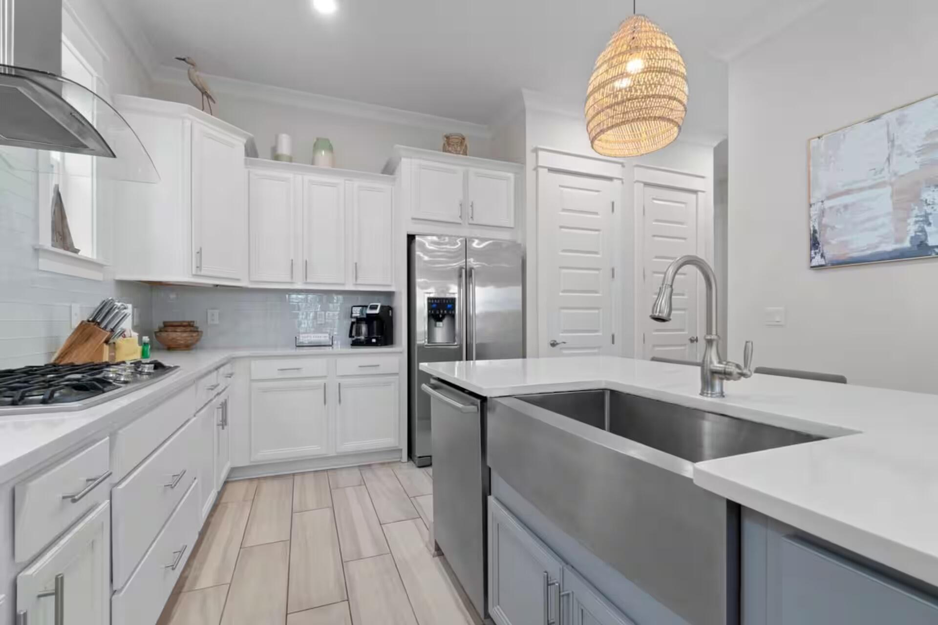 146 East E Pine, Unit B Inlet Beach, FL 32461 - Photo 11 of 47 a kitchen with a sink cabinets and window