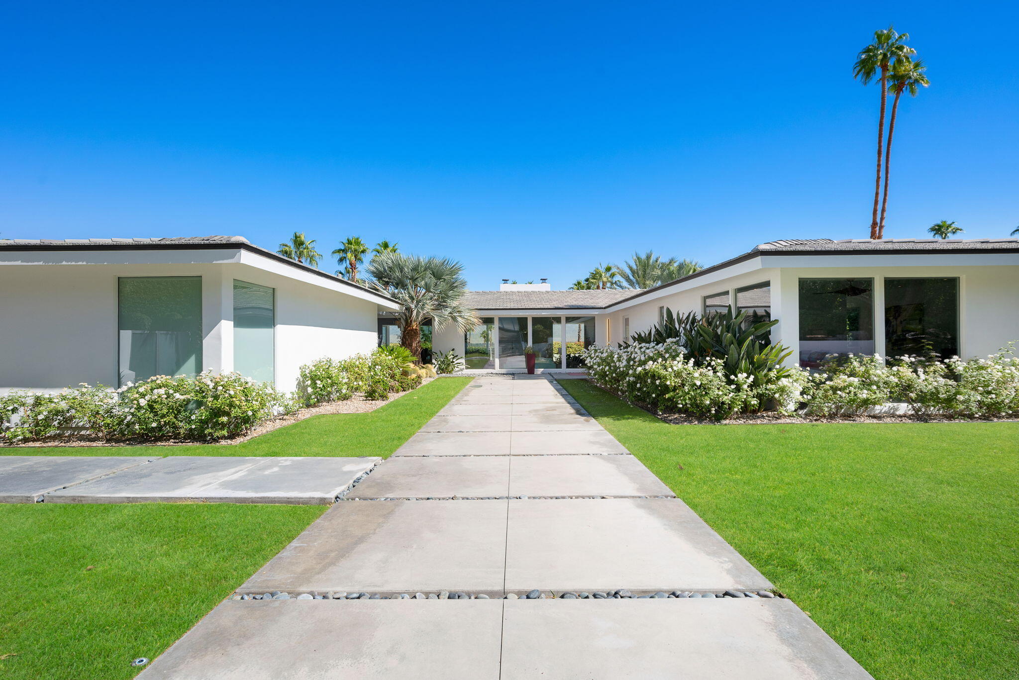 70288 Calico Road Rancho Mirage, CA 92270 - Photo 11 of 72 a view of a house with a yard