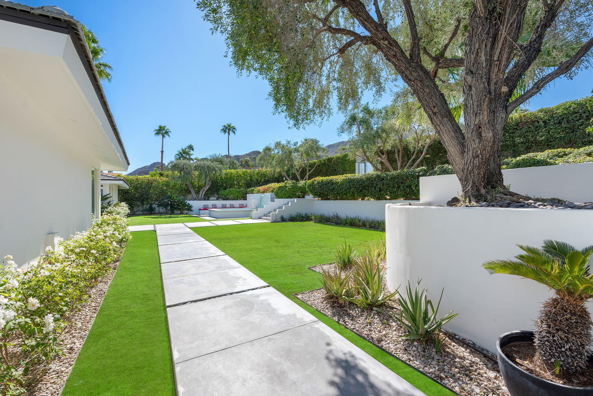 70288 Calico Road Rancho Mirage, CA 92270 - Photo 13 of 72 a view of a swimming pool with a patio