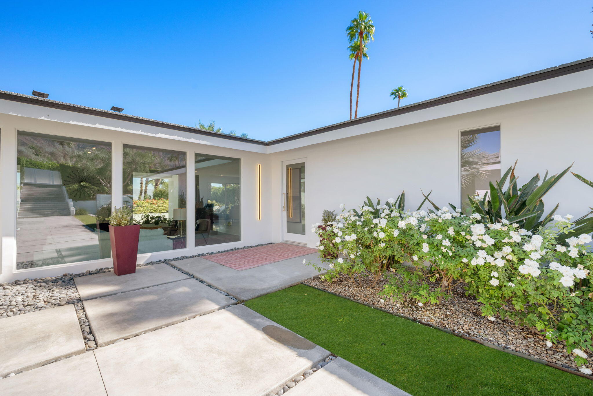 70288 Calico Road Rancho Mirage, CA 92270 - Photo 19 of 72 a front view of a house with garden