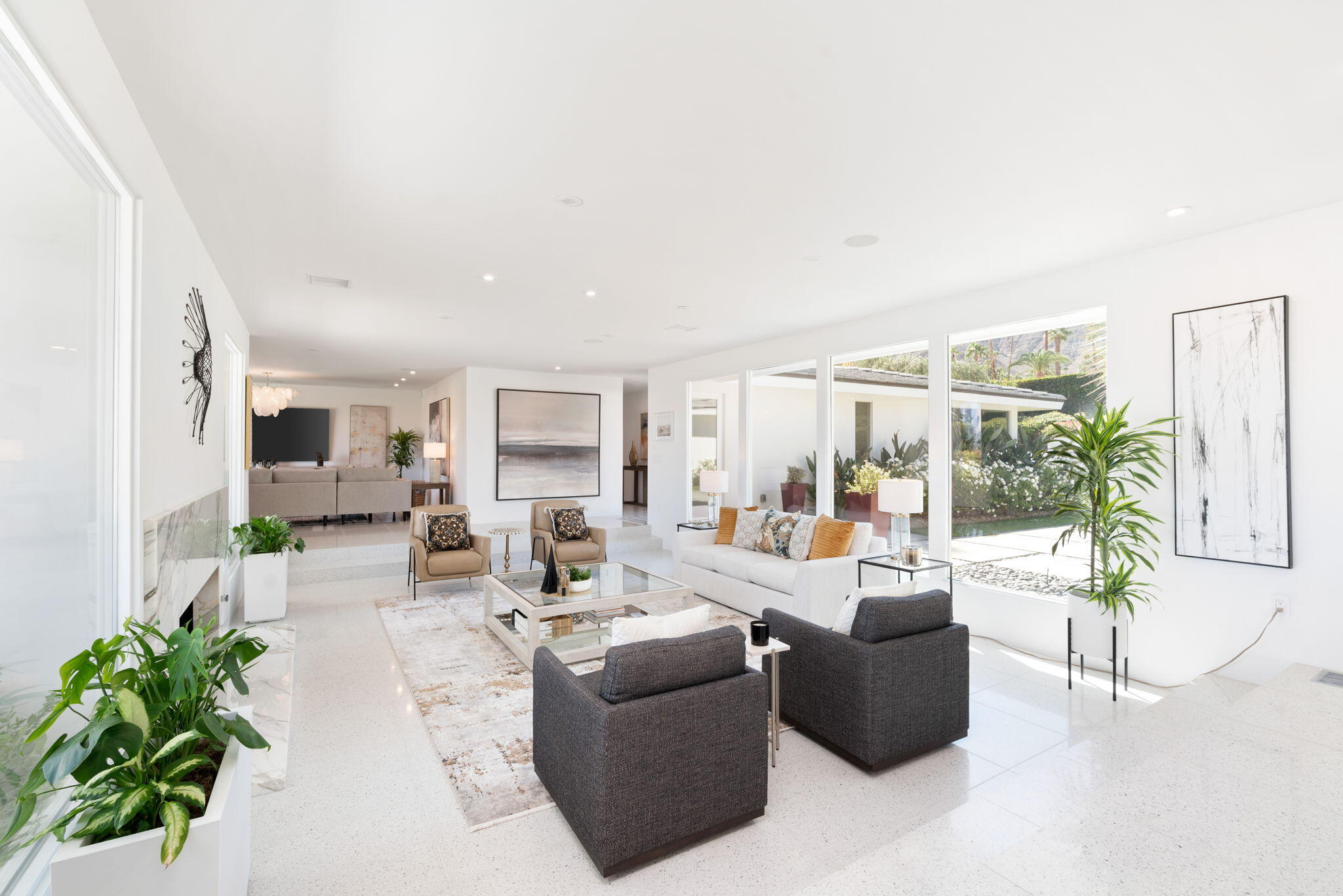 70288 Calico Road Rancho Mirage, CA 92270 - Photo 26 of 72 a living room with furniture potted plant and a large mirror