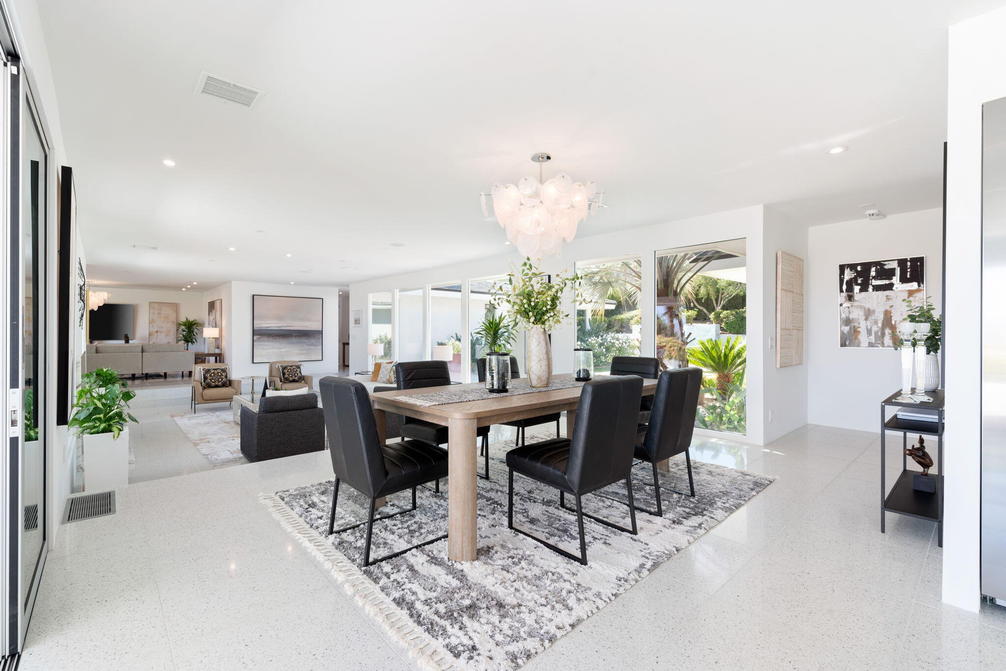 70288 Calico Road Rancho Mirage, CA 92270 - Photo 32 of 72 a view of a dining room with furniture and chandelier