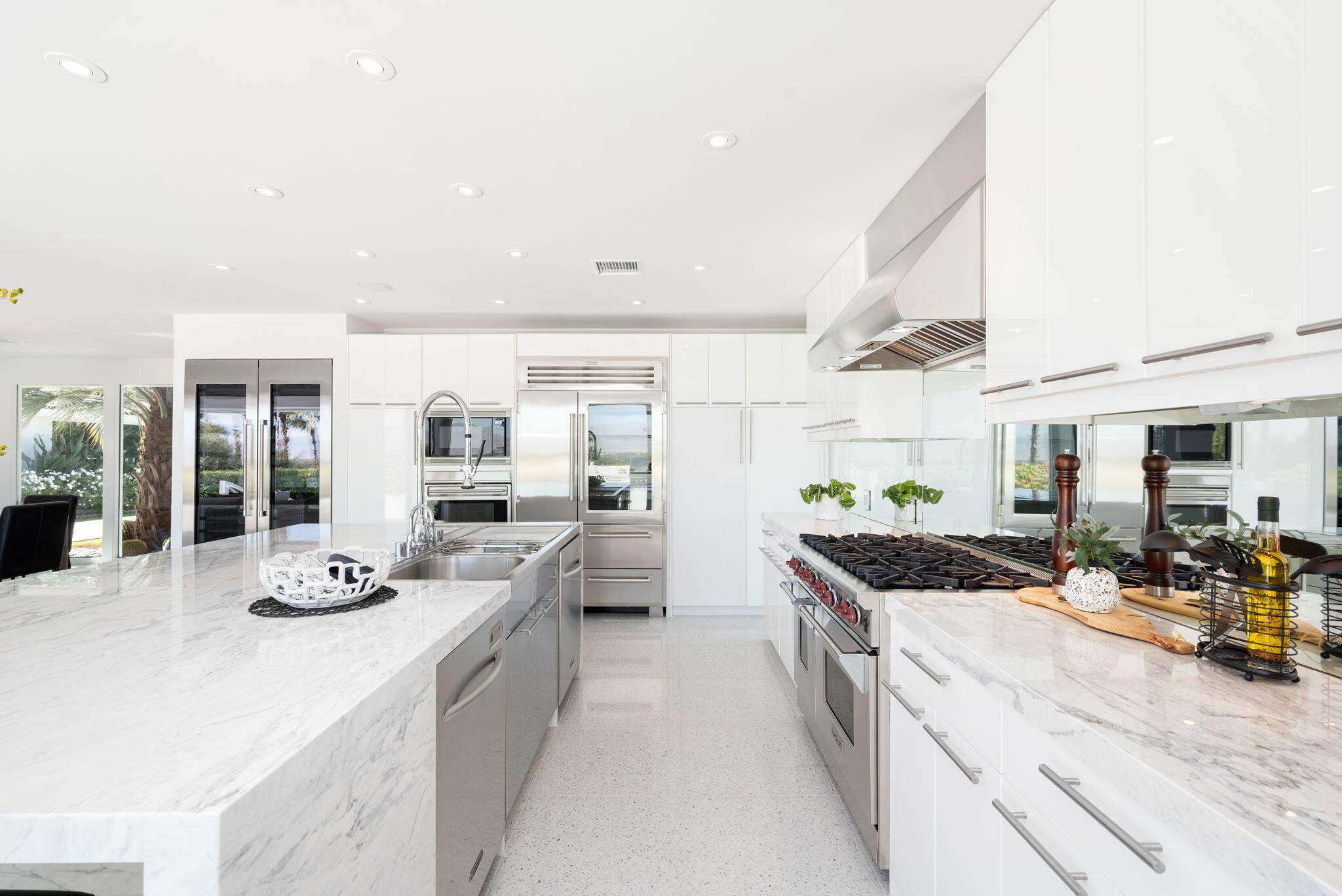 70288 Calico Road Rancho Mirage, CA 92270 - Photo 39 of 72 a kitchen with stainless steel appliances granite countertop a sink stove and refrigerator