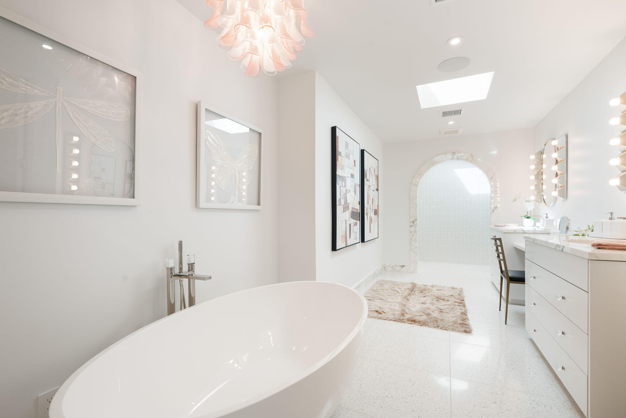 70288 Calico Road Rancho Mirage, CA 92270 - Photo 46 of 72 a bathroom with a sink a mirror and a bathtub