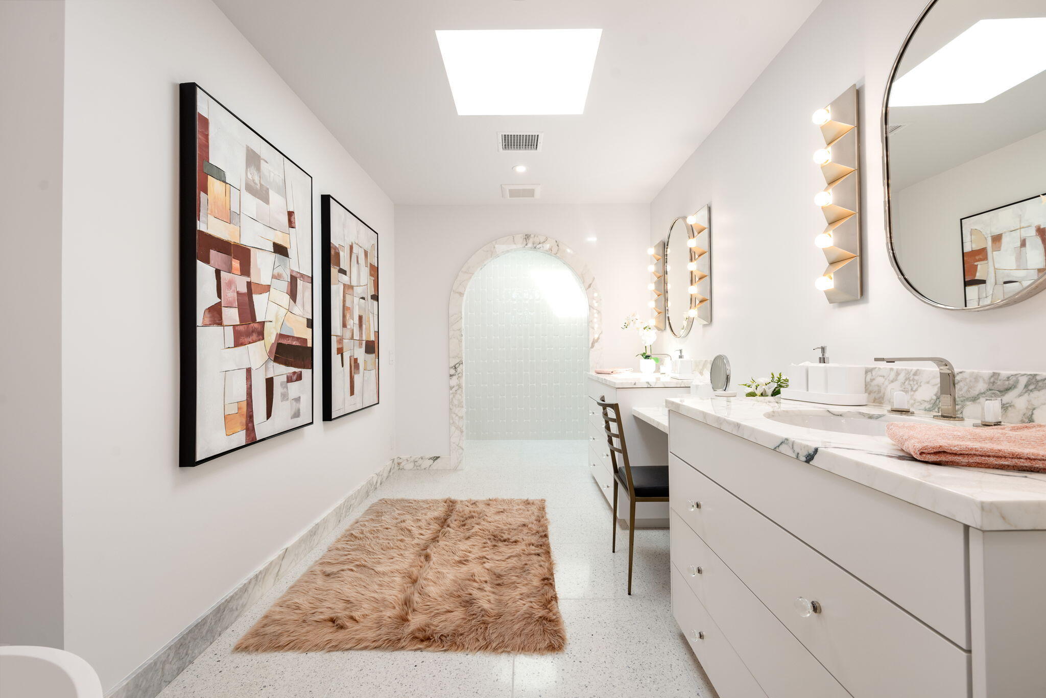 70288 Calico Road Rancho Mirage, CA 92270 - Photo 47 of 72 a spacious bathroom with a double vanity sink and a mirror