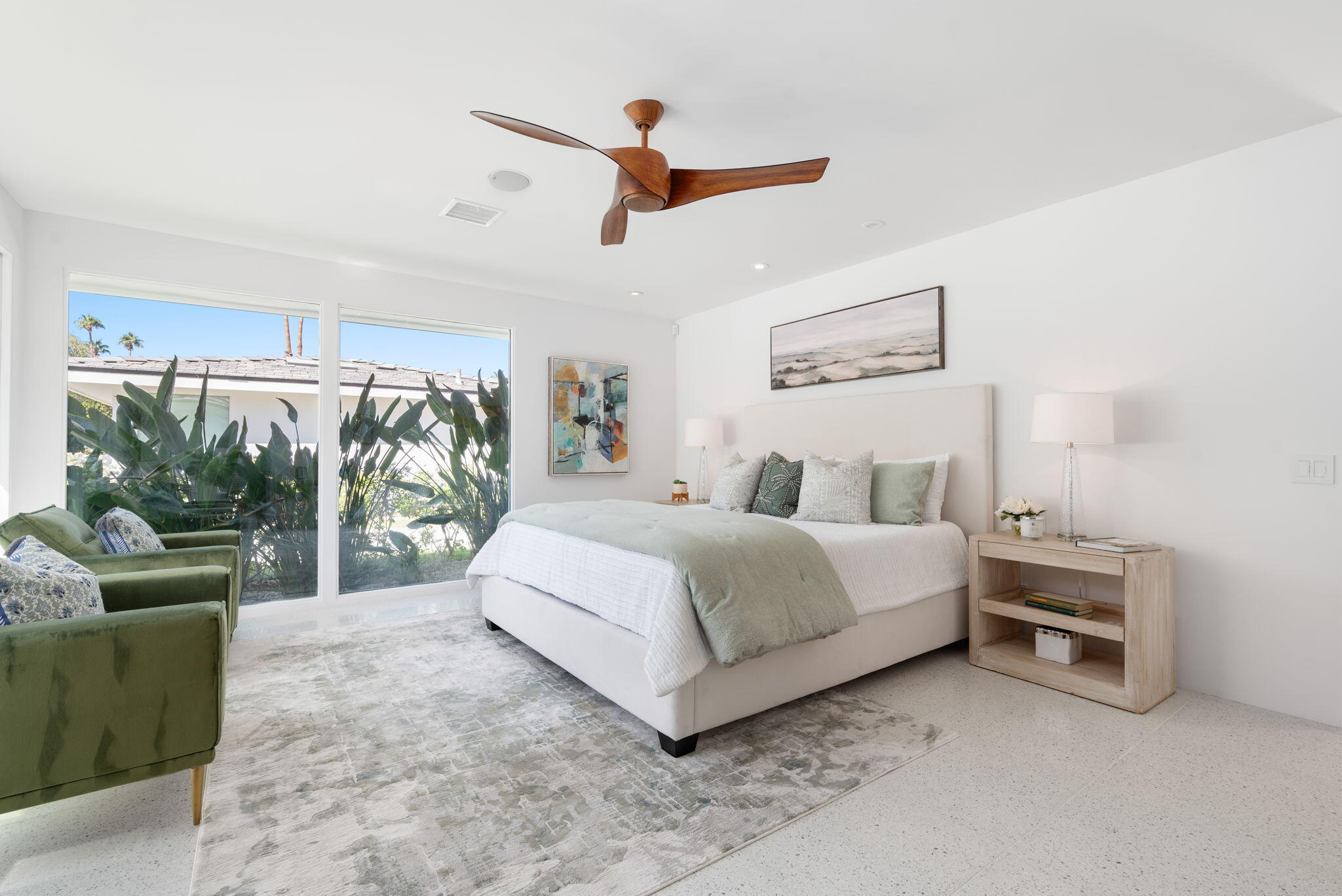 70288 Calico Road Rancho Mirage, CA 92270 - Photo 50 of 72 a spacious bedroom with a bed and a couch