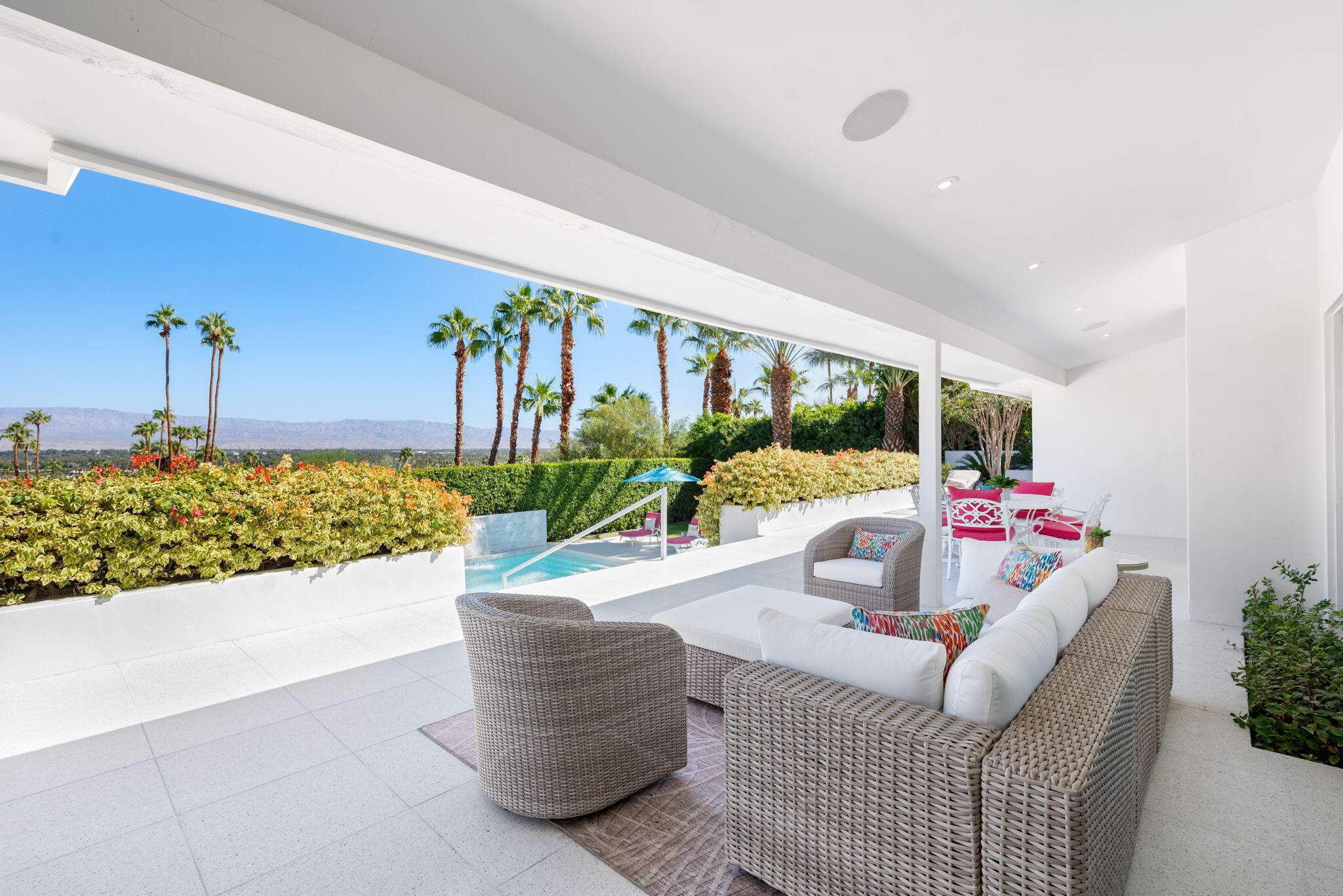 70288 Calico Road Rancho Mirage, CA 92270 - Photo 54 of 72 a living room with furniture and flowers