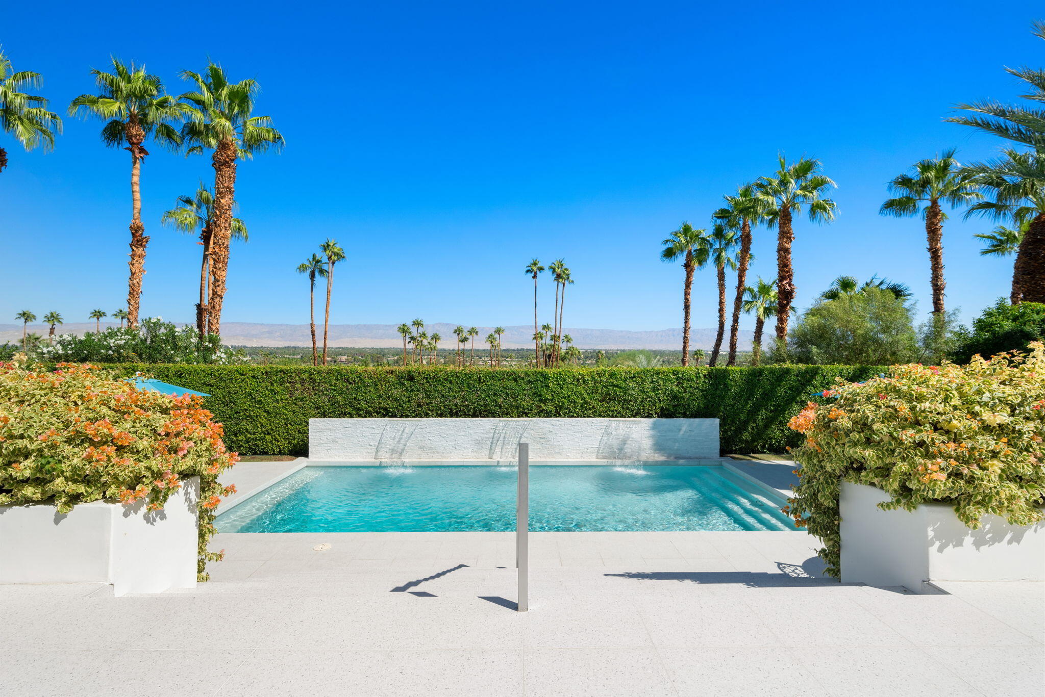 70288 Calico Road Rancho Mirage, CA 92270 - Photo 65 of 72 a view of a garden with a fountain