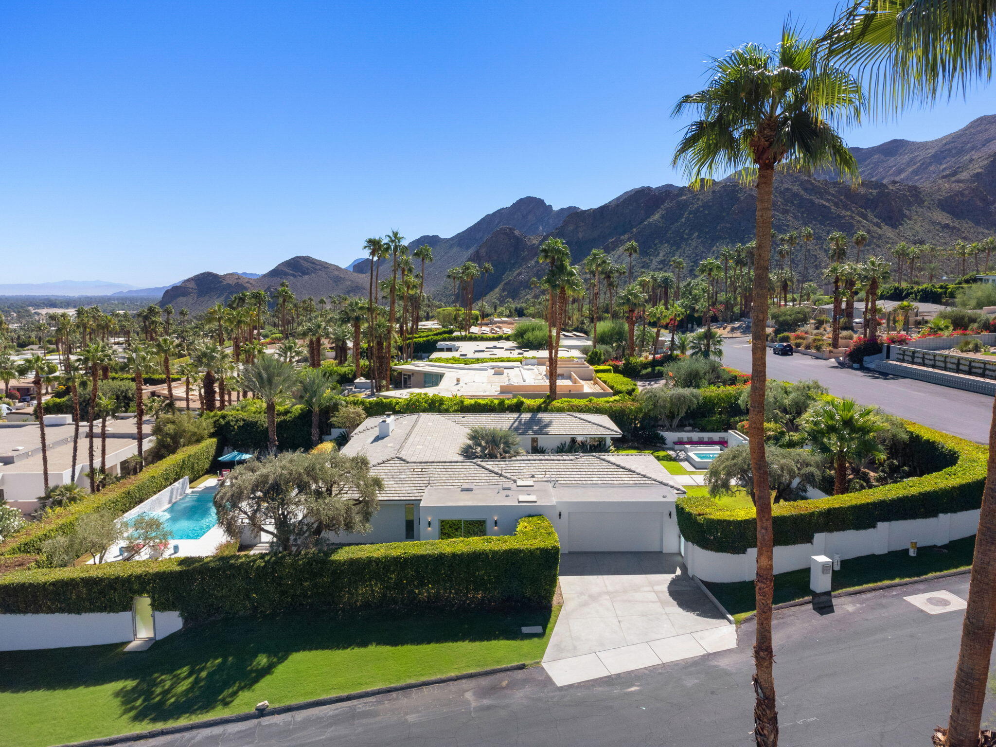 70288 Calico Road Rancho Mirage, CA 92270 - Photo 7 of 72 a view of a swimming pool and lounge chairs