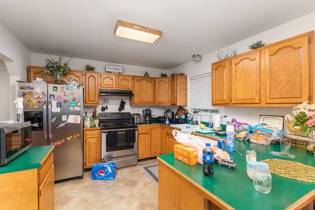 92 Rudolph Street Ruckersville, VA 22968 - Photo 10 of 27 a kitchen filled with a refrigerator a stove top oven a sink and dishwasher