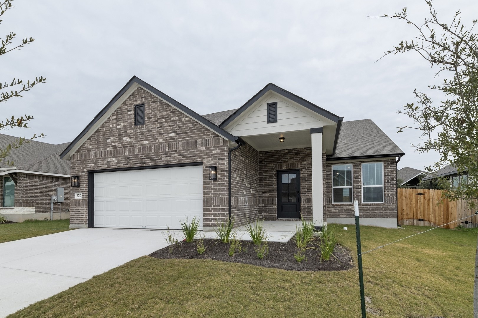 3717 Pin Oak Hills Seguin, TX 78155 - Photo 2 of 22 a front view of a house with garden