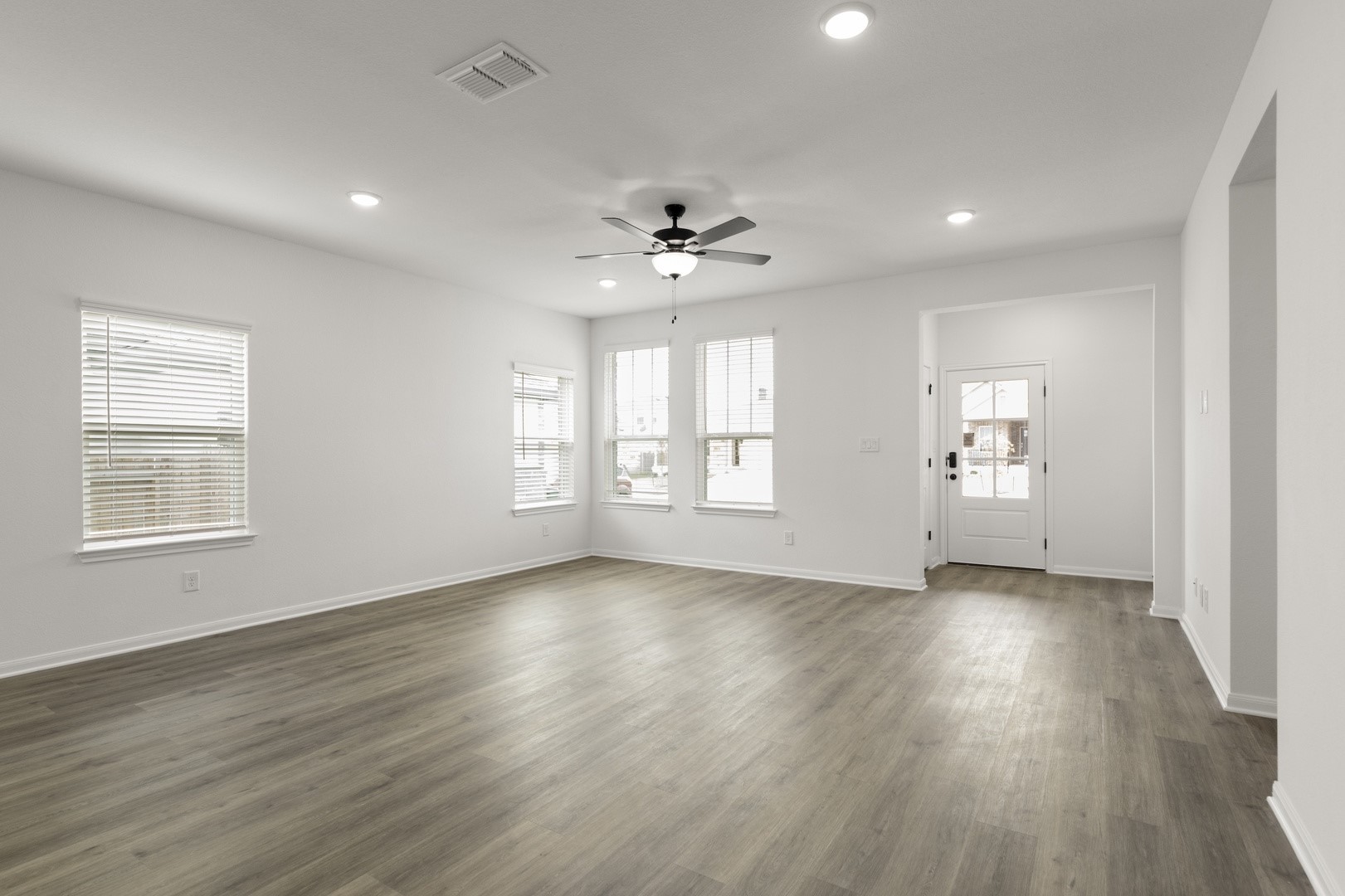 3717 Pin Oak Hills Seguin, TX 78155 - Photo 8 of 22 a view of an empty room with a window and wooden floor