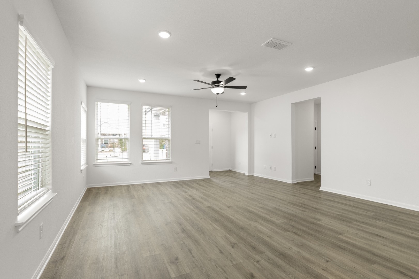 3717 Pin Oak Hills Seguin, TX 78155 - Photo 9 of 22 a view of an empty room with a window and wooden floor