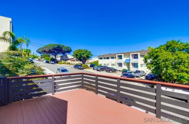 a view of balcony with furniture and potted plants
