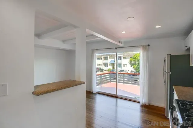 a view of entryway with wooden floor